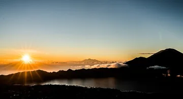 Sunrise view from Batur, below is Lake Batur and in the distance you can see Mount Agung and to the left in the distance Mount Rinjani on Lombok.